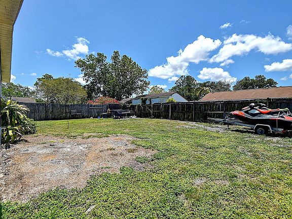 Large fenced back yard- wooden fence has been replaced with white vinyl fence