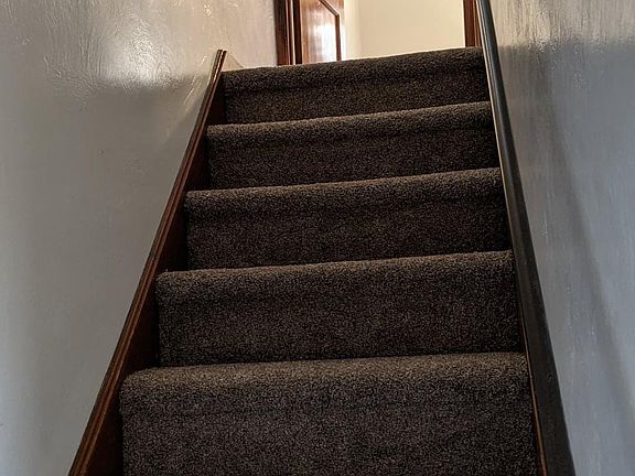 Stairs up to two bedrooms