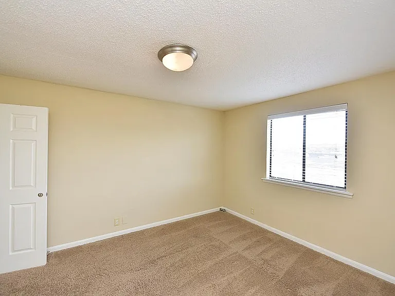 Experience tranquility in this bright and cozy bedroom, perfectly designed for relaxation.