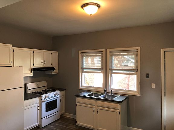 Newly remodeled kitchen including new windows, floor, appliaces, window treatments and more.