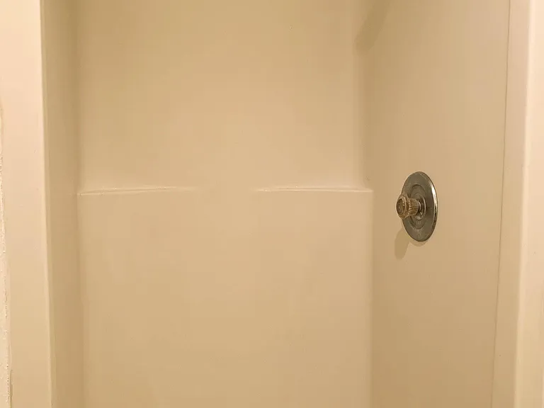Shower located in downstairs bathroom.