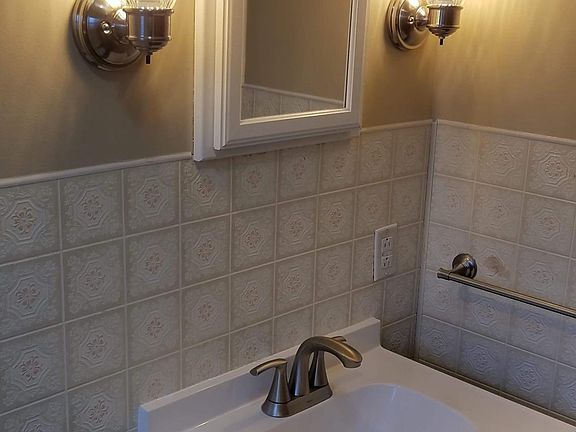 New flooring, lighting and vanity.