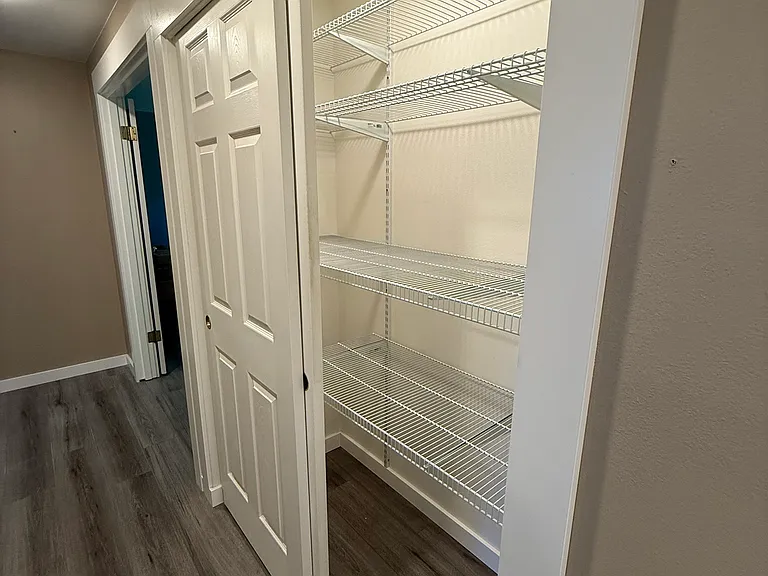 Large double closet. Can be used for general storage or as a kitchen pantry