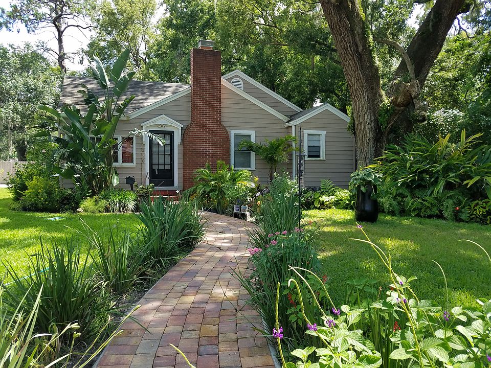 Front of house with picturesque curved sidewalk