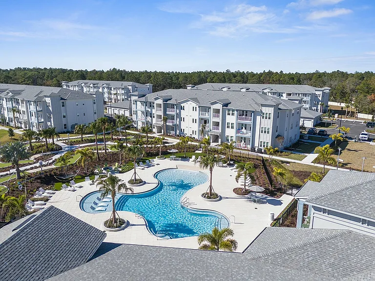 Experience resort-style living in this luxurious apartment community, complete with a stunning pool area.