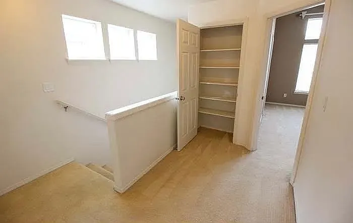 Upper-level loft area, suitable for a small office, reading area, or flexible living space.