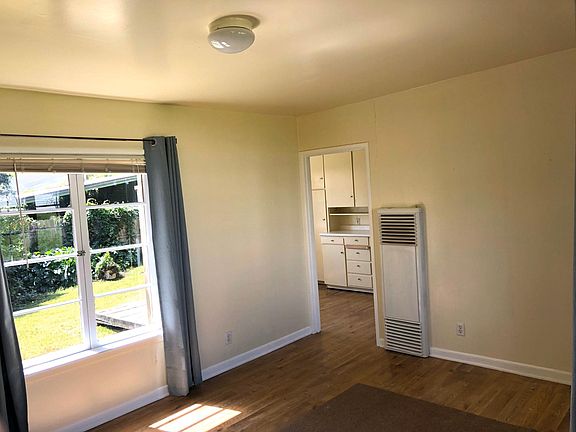 Living room with view through to kitchen