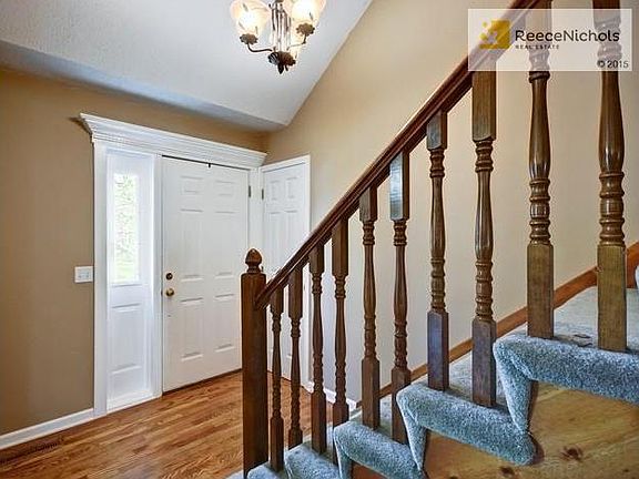 Entry.  Wood floors.  Wide staircase.