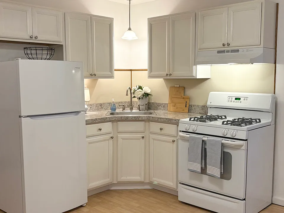 Kitchen with brand new refrigerator.