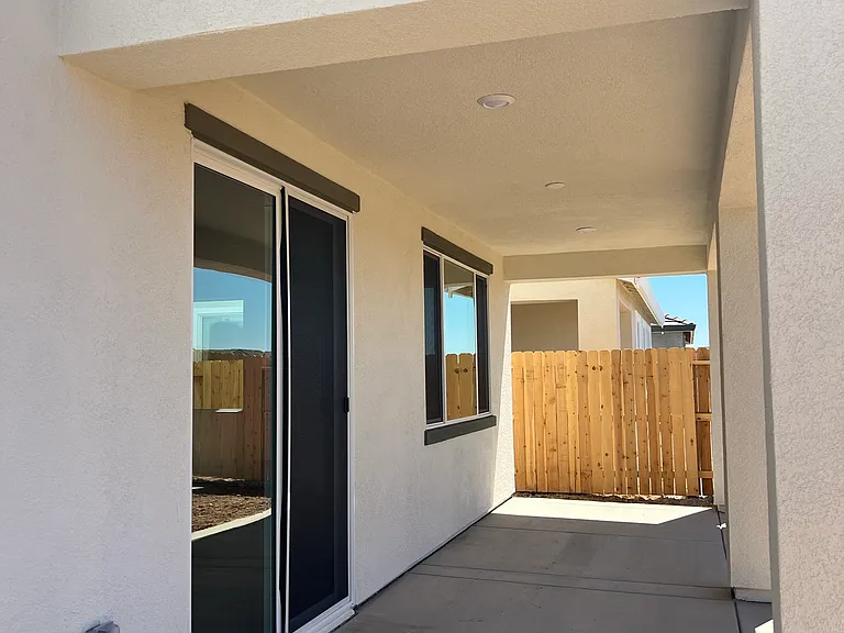 Covered Patio: Your own private backyard with a covered patio _ the perfect spot for morning coffee, weekend BBQs, or evening relaxation