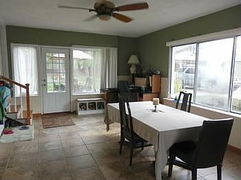 A grand dining room would make a very handsome family room.... overlooks the back cement patio