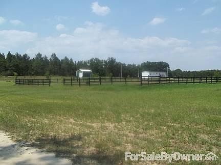 Riding arena
						:
						100x100 wood arena just built a few months ago.