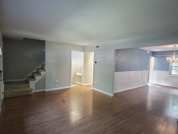 Living room with stairs to second floor