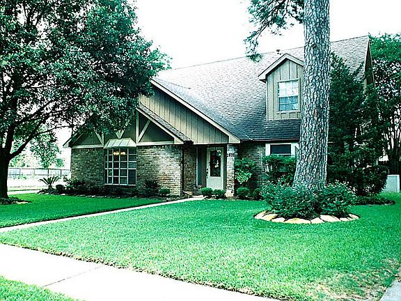 Another elevation from the side. A vacant lot is on the left of this home awaiting a new home constr