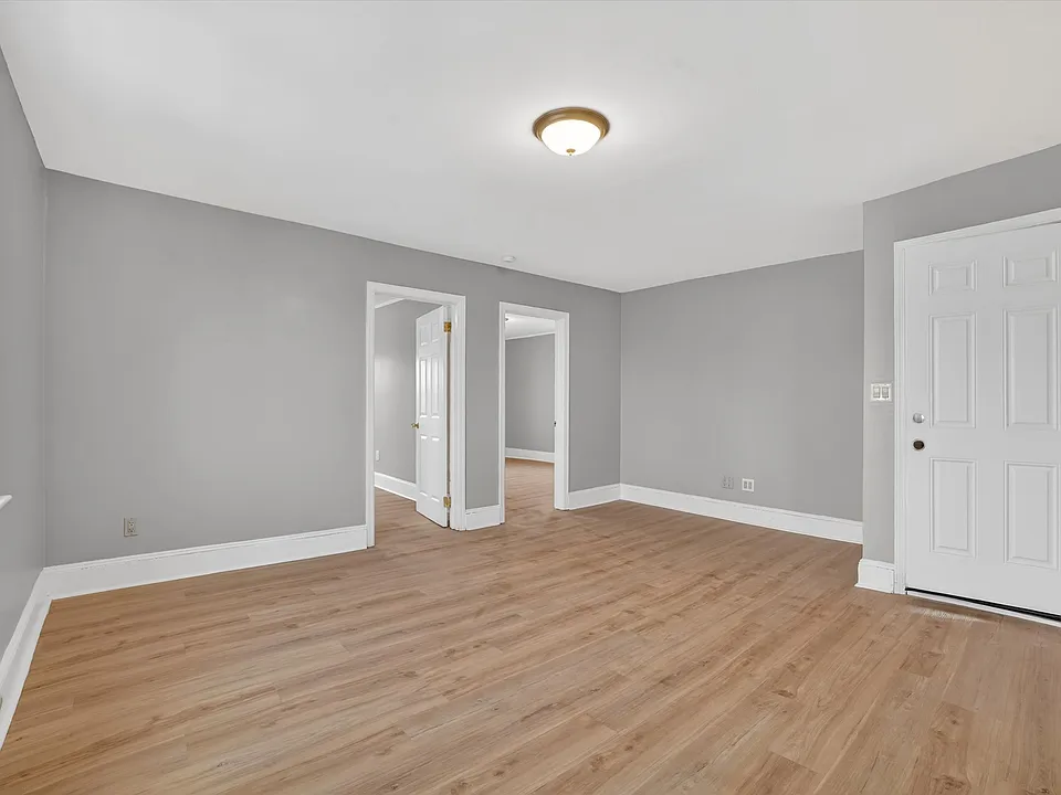 Living room w/ front entrance