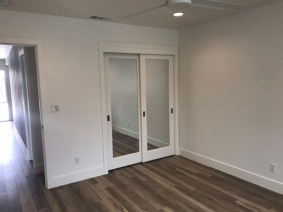 Second bedroom also large, ceiling fan, mirrored closets