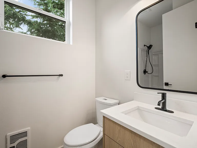 1st floor bathroom, shower seen in mirror