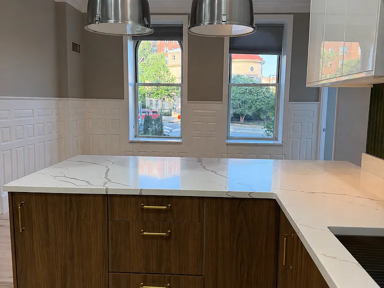 Kitchen facing living room Eastern windows