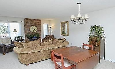 Open floor plan, working fireplace, and big patio doors onto private deck