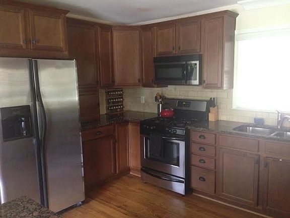 Kitchen. Stainless steel refrigerator, oven and dishwasher w