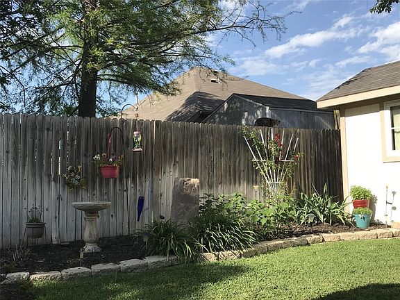WELL LANDSCAPED YARD.