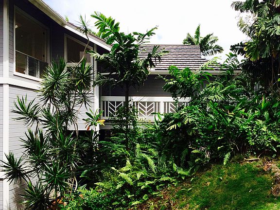 Two story home on sloping nature view lot w/upper & lower decks but no useable level yard.