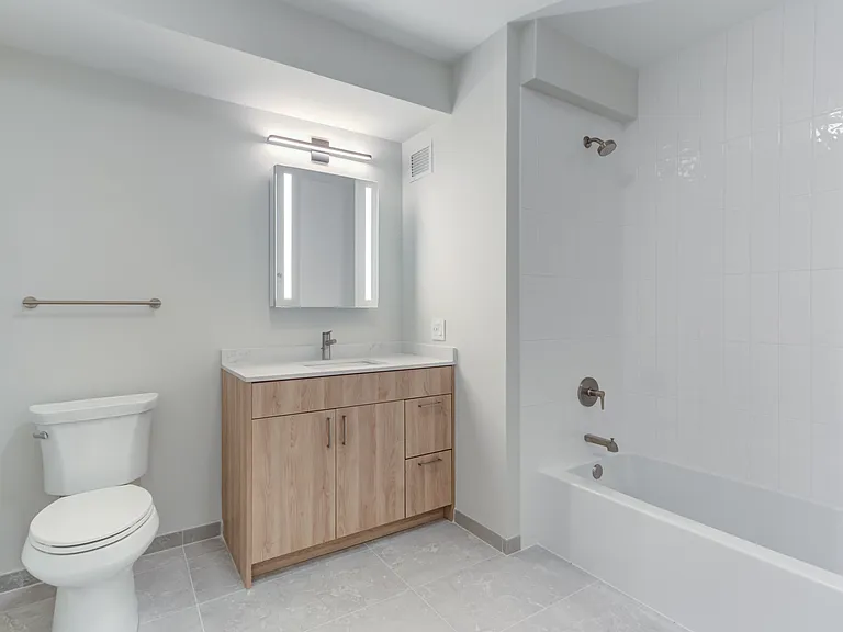 Elevate your daily routine in our apartment bathroom