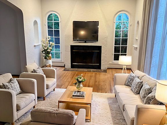 Large front living room with arched windows.