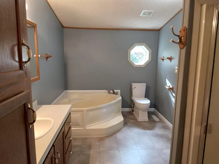 Master bathroom with soaker tub, shower and walk in closet.