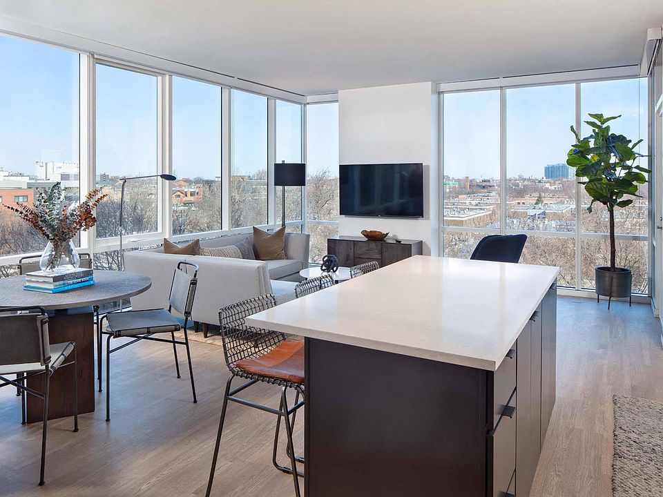 Experience the perfect blend of style and functionality in this open-concept kitchen and living room, with expansive windows that bring in plenty of natural light and showcase beautiful views.