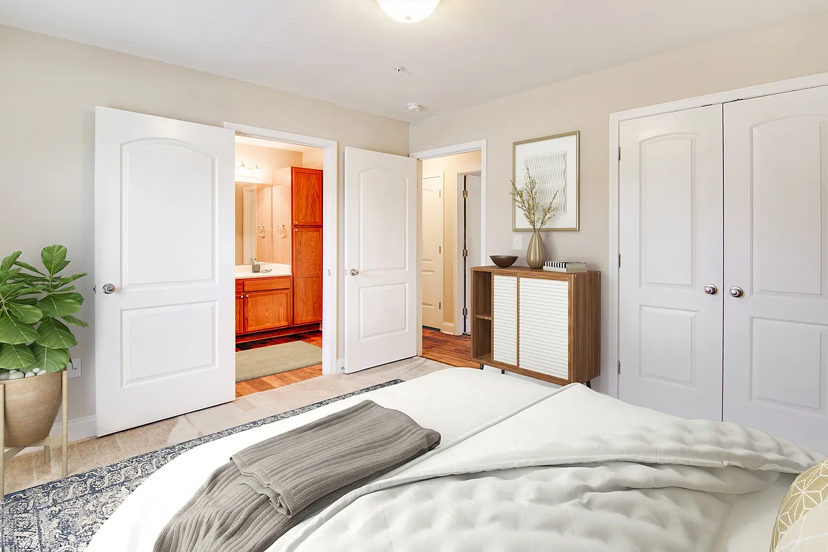 Experience luxury and comfort in this beautifully designed bedroom. - West Pointe