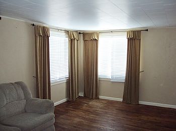 Living room with hardwood flooring.