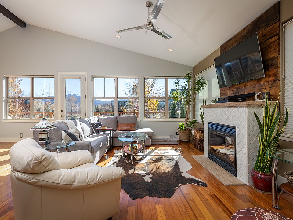 Great Room with vaulted ceiling. Main living area is on second floor with view of mountains.