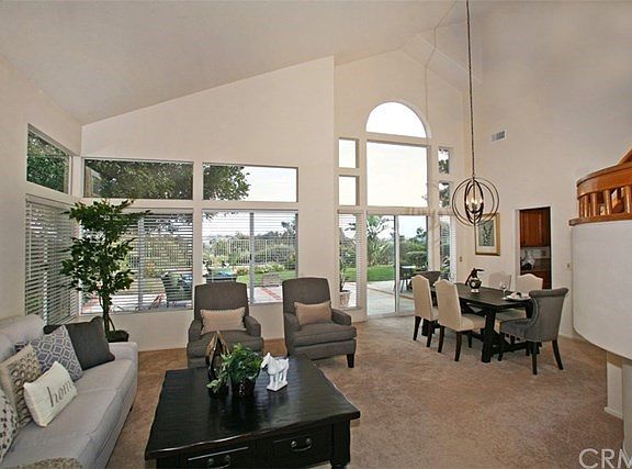 Beautiful Living Room and Formal Dining Room with Newer Sliding Door to the Beautiful Back Yard and View!