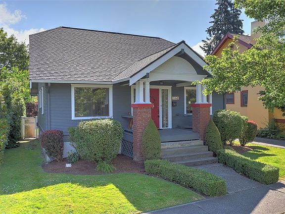 Classic colors and landscaping give this home charming curb appeal.>