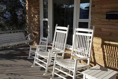 A front porch with plenty of rocking chair space