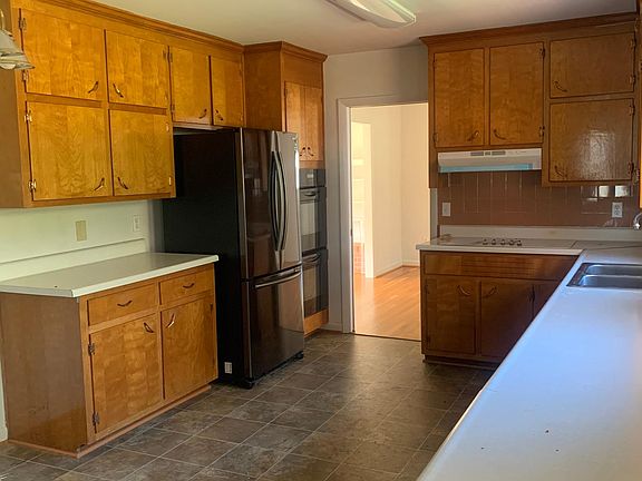 Spacious kitchen, almost new stainless refrigerator, dishwasher, and Jenn Air dual oven.