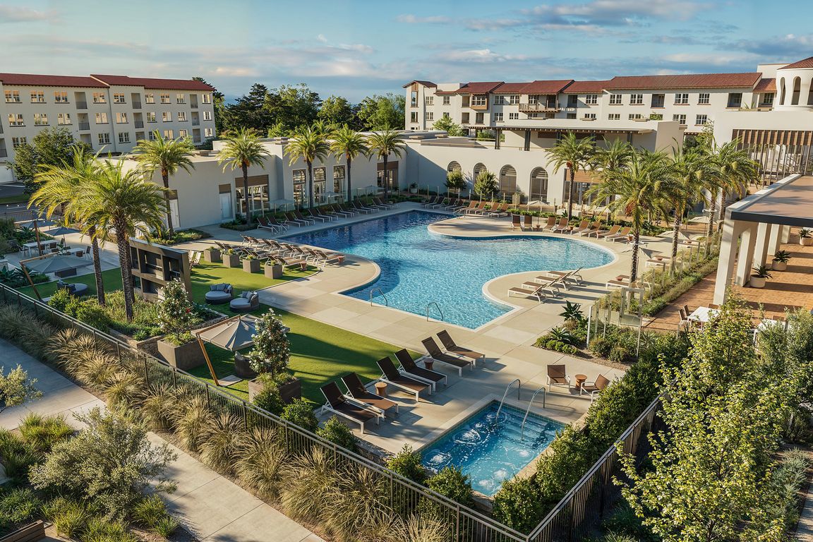Resort-Style Pool and Spa with lounge chairs