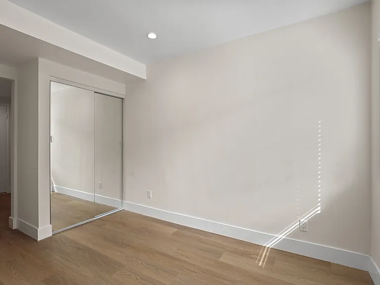 Bedroom with Large Mirrored Closet
