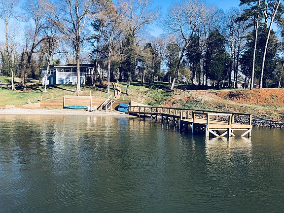 View from the lake showing the beach and dock.
