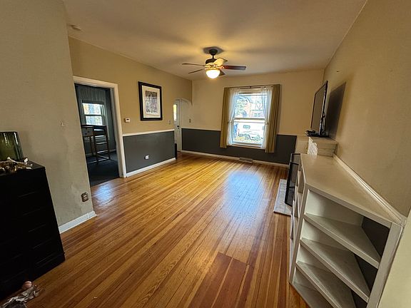 Living room with natural wood burning fireplace and built-ins