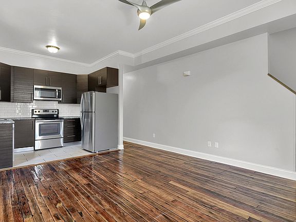 kitchen & family room - level 1: contemporary open floor plan, salvaged wood floors, crown moulding