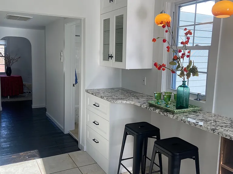 kitchen view into hall and dining room/ office space