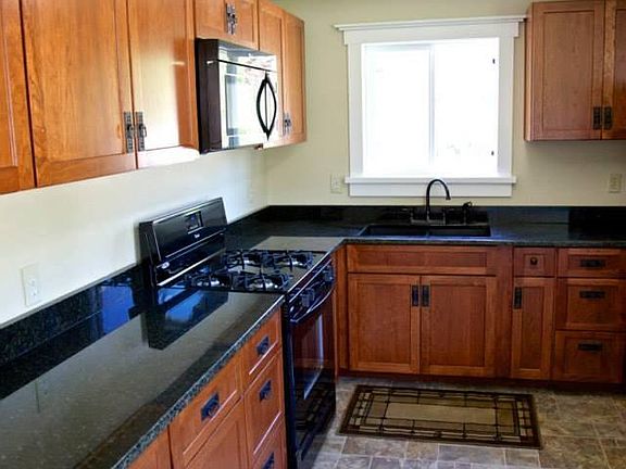 Gas stove, Lots of storage in custom cherry cabinets fully stocked kitchen with all kitchenware needed. This was an airbnb