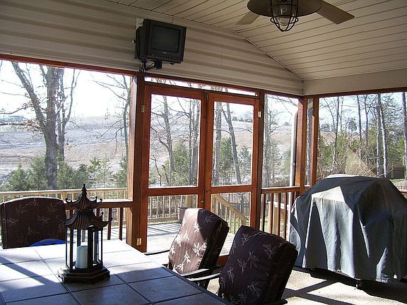 Love the screened porch with TV & ceiling fan!