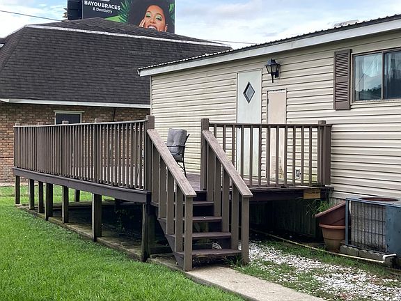 Rear deck - there is an outdoor storage shed that houses water pump