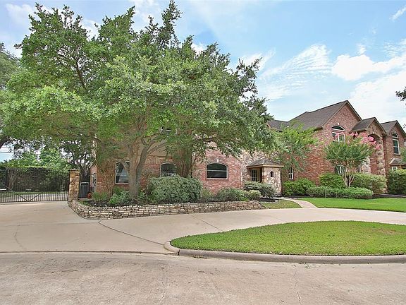 The circular driveway is perfect for unloading groceries in to the utility/Mud room or for overflow parking during holiday gatherings. The gated driveway entry in to the garage out back is convenient and offers extra privacy.