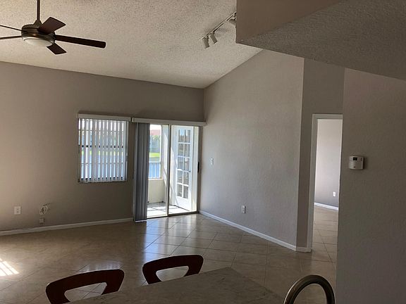 Open floor plan, tiled, vaulted ceilings.