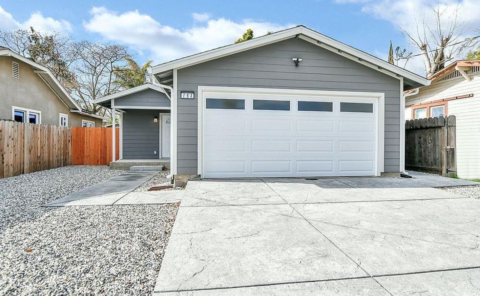 Exterior of House: Driveway Parking and Garage.