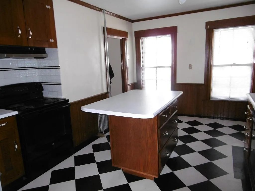 Kitchen floor to be replaced before move in. - 497 Hanover St #2